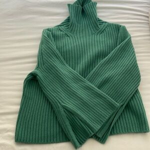 Green turtleneck sweater